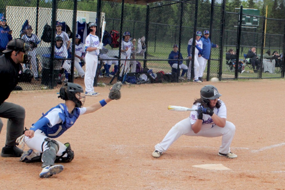 Sidney Walgren of the Lac La Biche 15U AA Dodgers ducks as a ball is thrown at her during the recent home game against the South Jasper Park Jays . The Jays won 12-2. Chris McGarry photo.