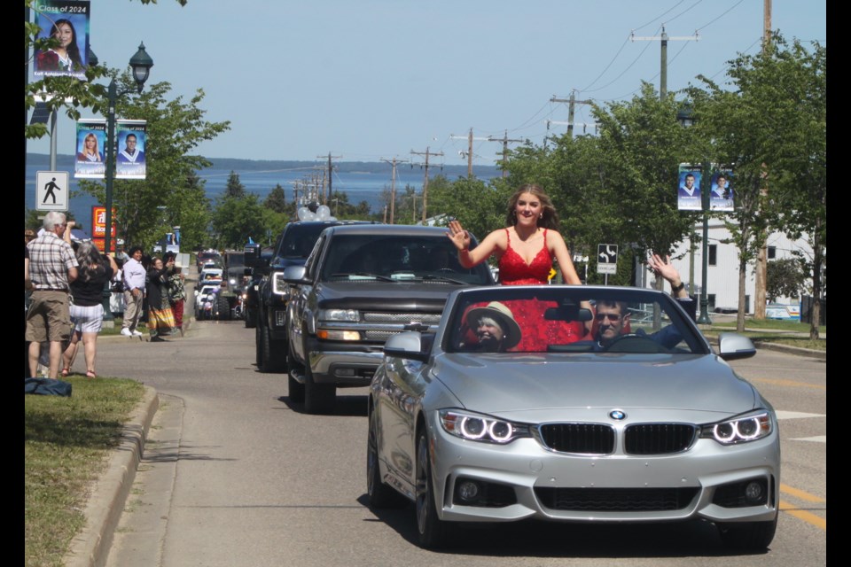 JAWS graduate Sierra Hauser travelled with style in this silver BMW convertible during the parade. Chris McGarry photo.