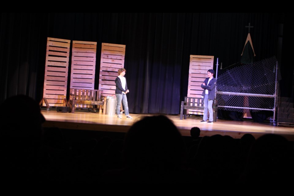 Ponyboy Curtis (Amri McKay) and Sodapop Curtis (Alice Cardinal) have a brotherly talk during a scene in the JAWS production of the Outsiders, which was had performances at Portage College's McGrane Theatre from Dec. 17-19. Chris McGarry photo. 