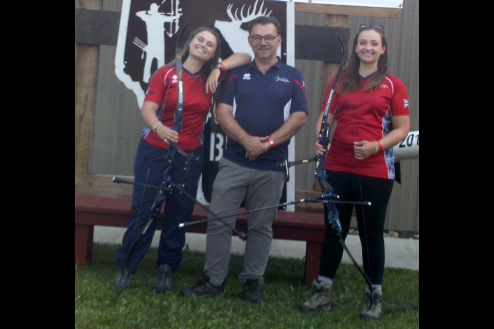 British archers Sophie Meering and Imogen Sullivan-Bell with the coach of the UK team, Jon Nott. Chris McGarry photo. 