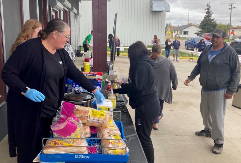 Lisa Swan was busy serving hot dogs during the Fetal Alcohol Spectrum Disorder awareness event that was held at the Lac La Biche office of the Lakeland Centre for FASD recently. Chris McGarry photo. 