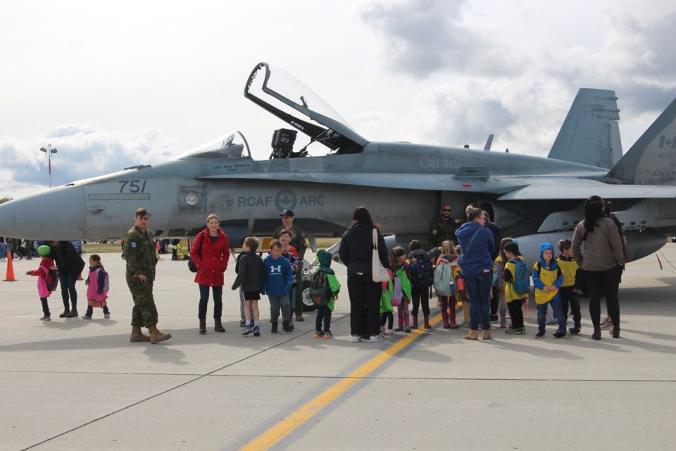 Children from schools exploring one of the three CF-18 fighter jets at the open house.