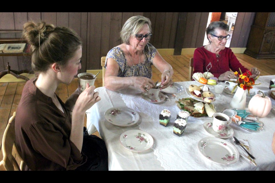 Phoenix Murphy, Marianne Gervais, and Fern Plamondon engage in some conversation while enjoying the tea, sweets, and sandwiches which were served at the old-fashioned afternoon tea party, which took on Friday, Sept. 15 at the old convent on the grounds of the Lac La Biche Mission. Chris McGarry photo.