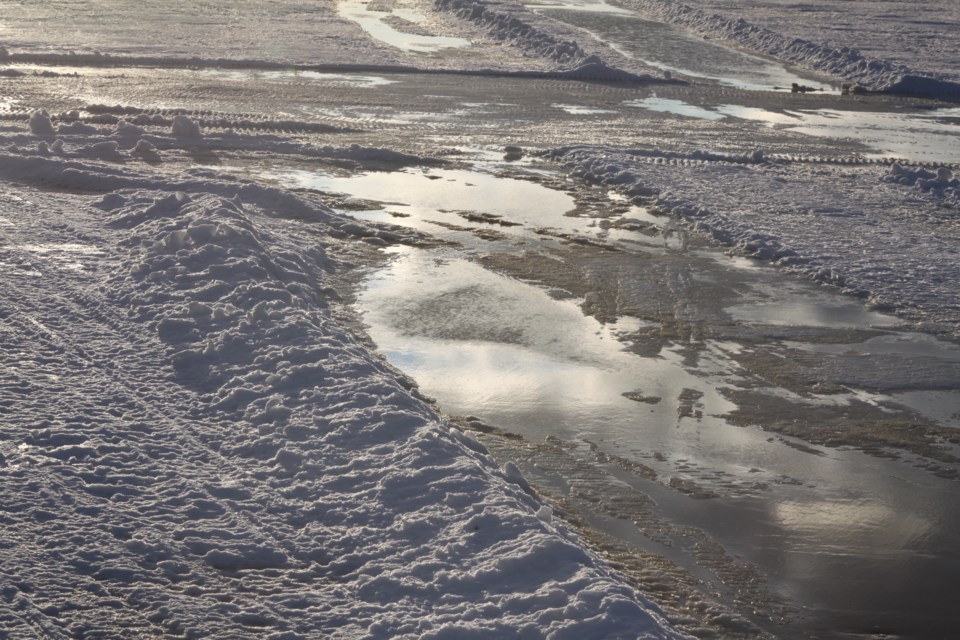 Due to recent warm temperatures, up to two inches of water has formed on the frozen surface of Lac La Biche Lake, which has forced organizers of this weekend’s Lac La Biche Festival to cancel the ice races as well as the on-ice aircraft fly-in. Chris McGarry photo. 