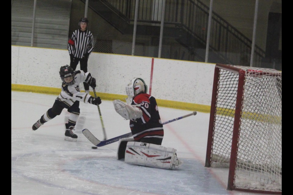 Lac La Biche Clippers U11 goaltender Weston Wladyka defends his net against an attack by a member of the Kitscoty Knights. The two Northeastern Alberta Hockey League (NEAHL) squads faced off against each other at Lac La Biche’s Bold Centre on Feb. 15 and 16. Kitscoty won the first game 11-2 and the second 10-2. Chris McGarry photo.