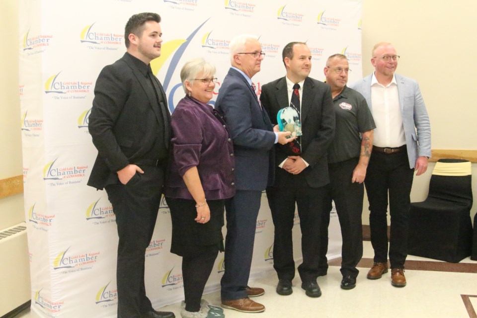 Axel Axmann president (third from left) of  Cold Lake Aeros Junior A Hockey Club and his staff were one of the award winners for this year's Business of the Year Awards in Cold Lake.