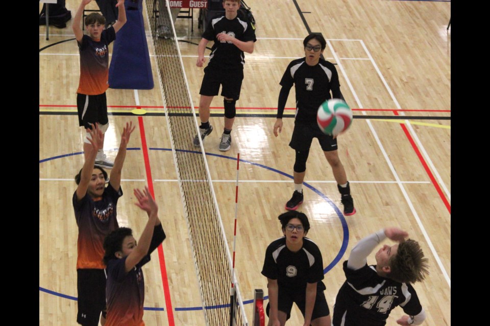 The JA Williams (JAWS) High School JV boys Sharks volleyball team faces off against the Cold Lake Cobras during a match that took place during the JV Districts tournament on Tuesday, Nov. 5. Both the JAWS boys and girls finished first place overall in the competition. Chris McGarry photo. 