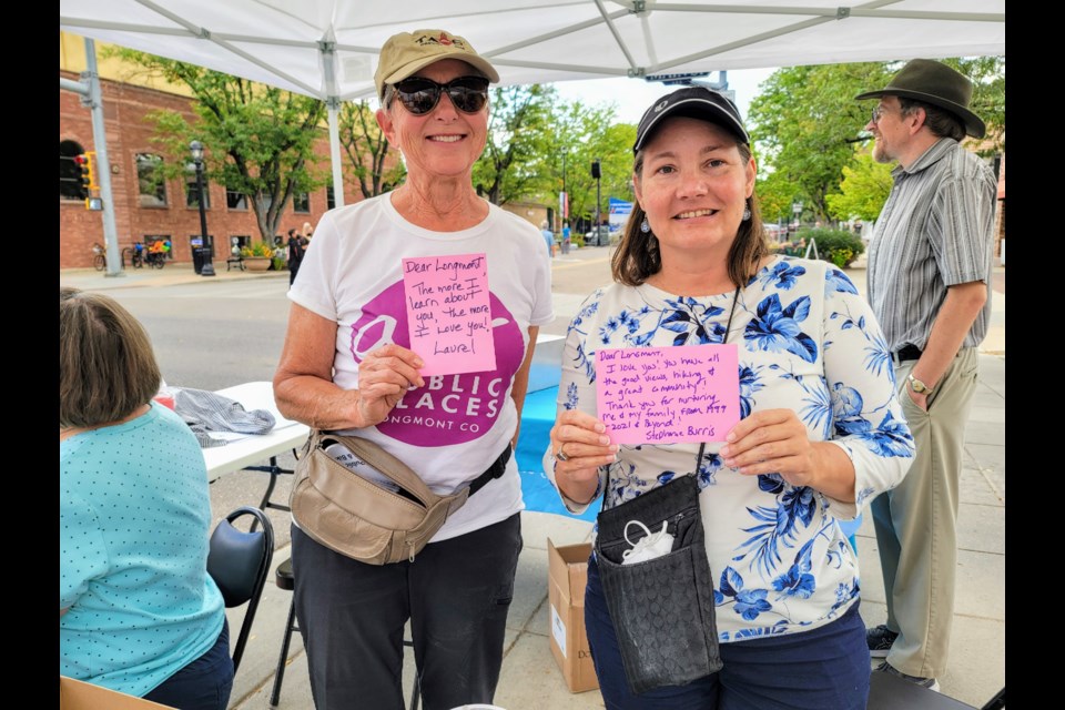 AIPP Commissioners Laurel Alterman and Stephanie Burris writing their Love Letters to Longmont while volunteering at the ArtWalk event in September. (image courtesy of Stephanie Burris)