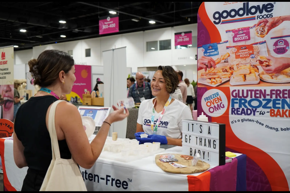 Chennelle Diong, CEO of Longmont-based GoodLove Foods, chats with a customer.