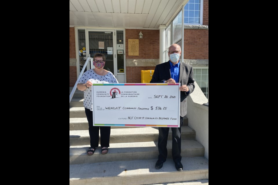 Round two of HCF COVID-19 Community Response Fund is providing additional financial support to Wendat Community Programs. The $536 grant will assist Wendat with the ongoing costs of PPE and IPAC supplies. Pictured are Wendat executive director Andrea Abbott-Kokosin and HCF executive director Scott Warnock.