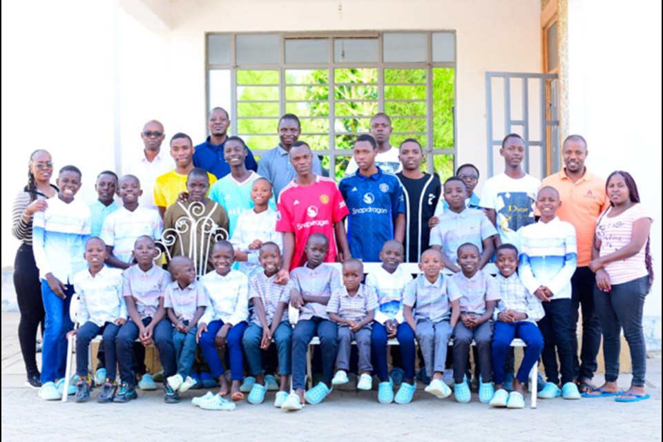 The boys are pictured with some of the staff.