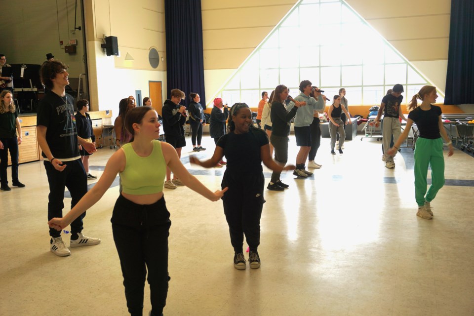 St. Theresa's students working on a dance number during a rehearsal in the school's auditorium.