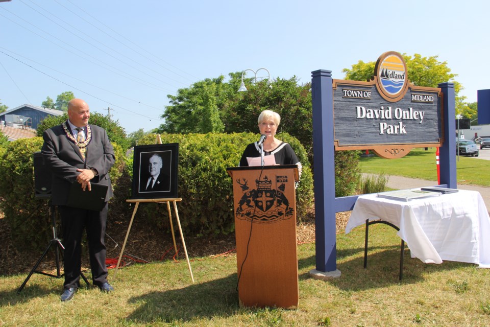 Ruth Anne Onley, former Lieutenant Governor David Onley's widow, addresses the crowed gathered Tuesday morning for the re-dedication of David Onley Park at the Midland Harbour.