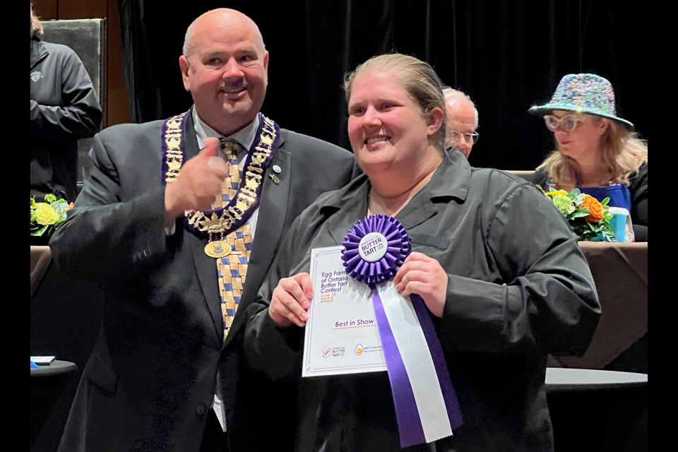 Joanne Chappelle, shown with Mayor Bill Gordon, won best in show at Ontario’s Best butter Tart Festival in Midland on Saturday.