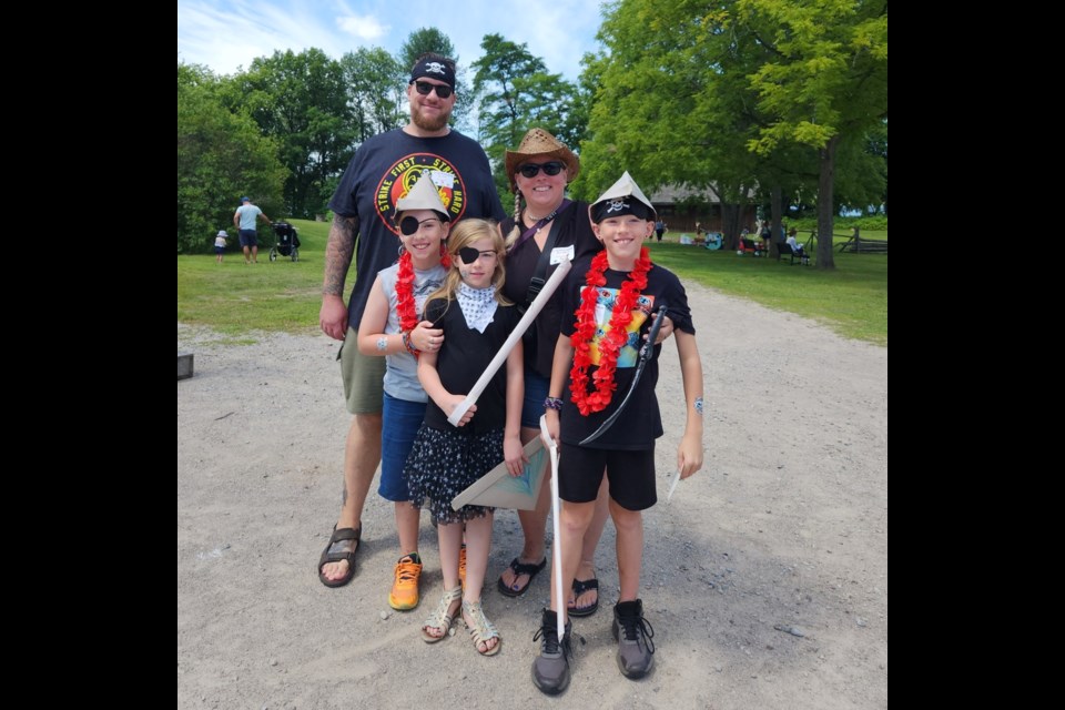 A young family enjoys Pirates of the Bay at Discovery Harbour.