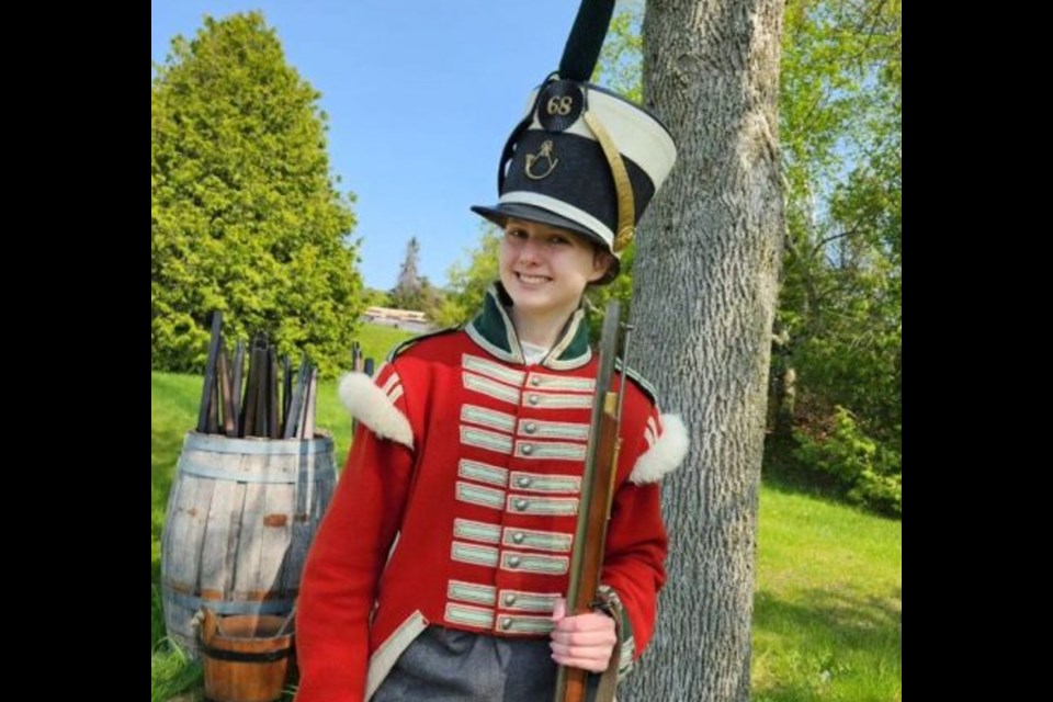 A new recruit enjoys the day at Discovery Harbour in Penetanguishene.