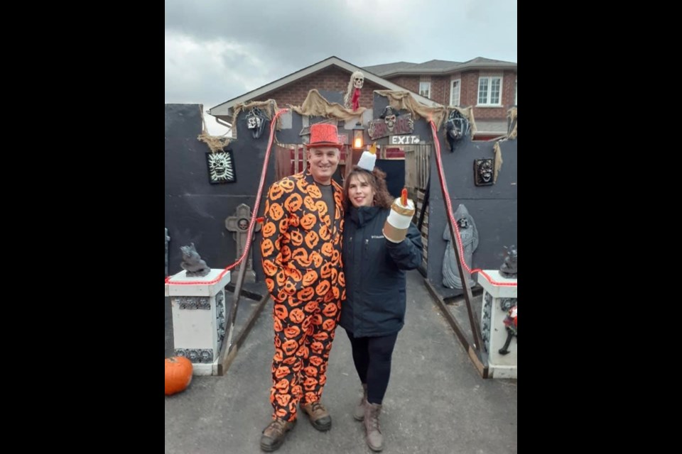 David and Lisa Brunelle collect donations for the Candlelighters Simcoe during annual Halloween event.