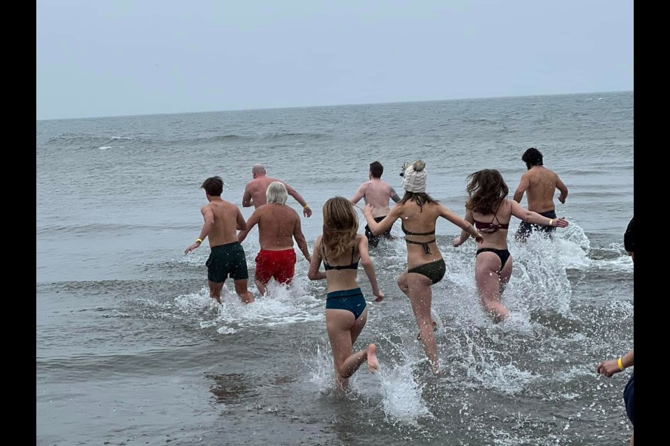 Polar bear dippers 'enjoy' a frigid Georgian Bay swim at Balm Beach.