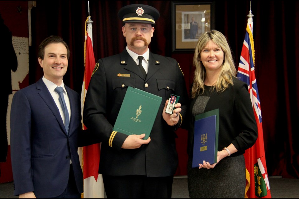 Midland firefighter Cale McLean honoured for being a key advocate for youth throught involvement with Camp Ignite in 2022 and 2024, collaborating with Big Brothers Big Sisters of North simcoe. He is seen with Simcoe North MP Adam Chambers and Simcoe North MPP Jill Dunlop.