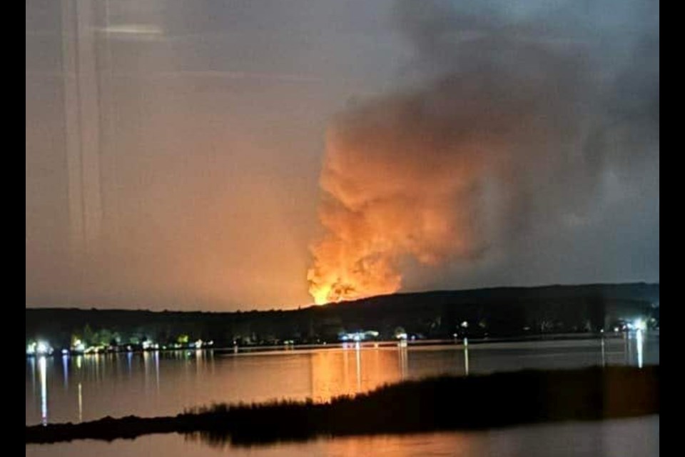 Huge plumes of flame and smoke were visible for kilometres after barns at North Simcoe Veterinary Service went up in flames Thursday evening.