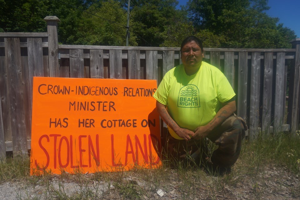 In this file photo, Johnny Hawke is pictured at an encampment he started in Thunder Beach where Carolyn Bennett has a cottage.