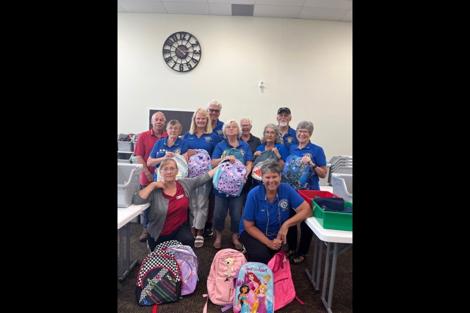 The Penetanguishene Lions Club donated $1,000 and helped pack and deliver 200 backpacks to children in need through Glowing Hearts Charity's Backpacks for Youth program in Simcoe County.