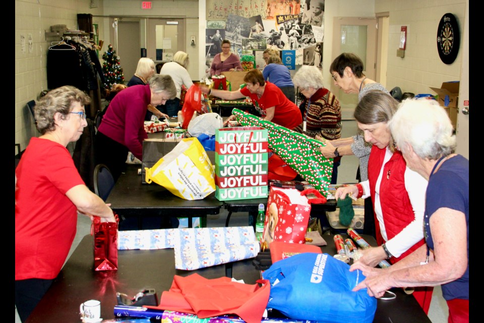 Askennonia Senior Centre elves volunteer to purchase and wrap gifts for the Santa for a Senior program. 