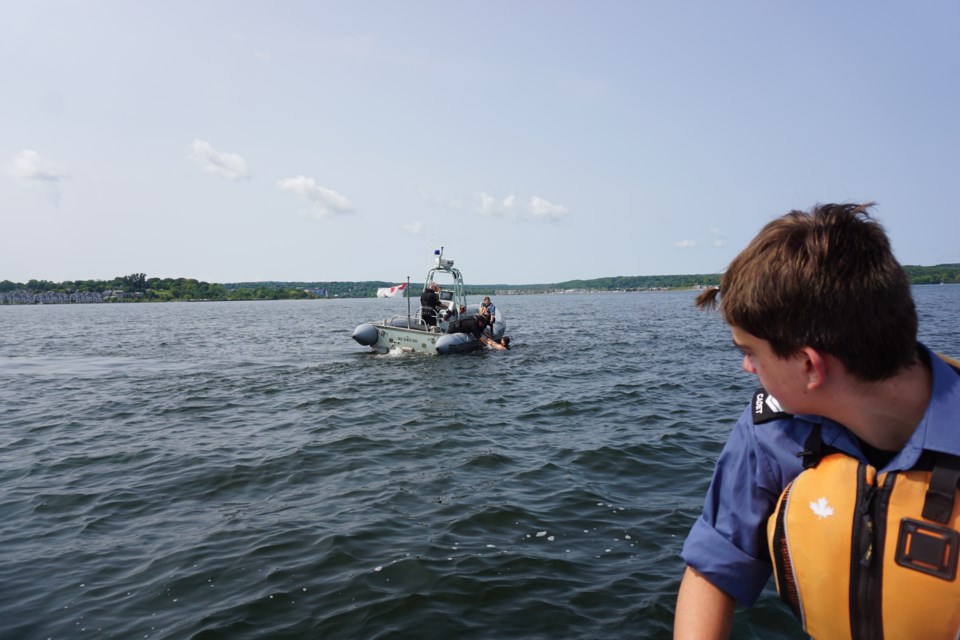  A local sea cadet observes HMCS York rescue operations on Georgian Bay Tuesday.                              