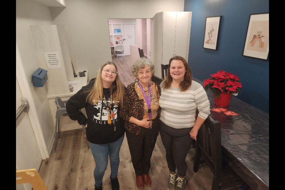 Huronia Transition Homes staff Meagan Kelly, Helen Higgins and Haily MacDonald are seen in the dining area at La Maison Rosewood Shelter.