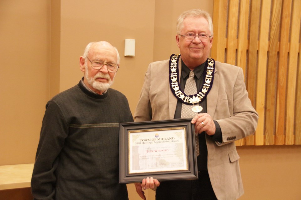 Jack Wilford received the 2020 Heritage Appreciation Award at council. He is pictured receiving his award from Mayor Stewart Strathearn. Mehreen Shahid/MidlandToday