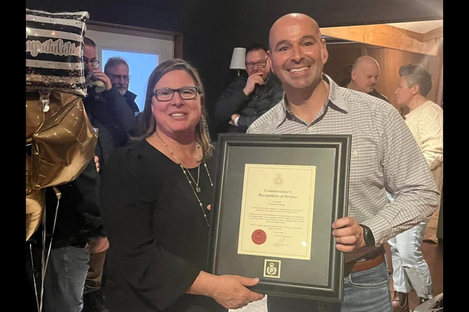 Carolynn Patton receives an honour from Southern Georgian Bay OPP Insp. Todd Pittman.