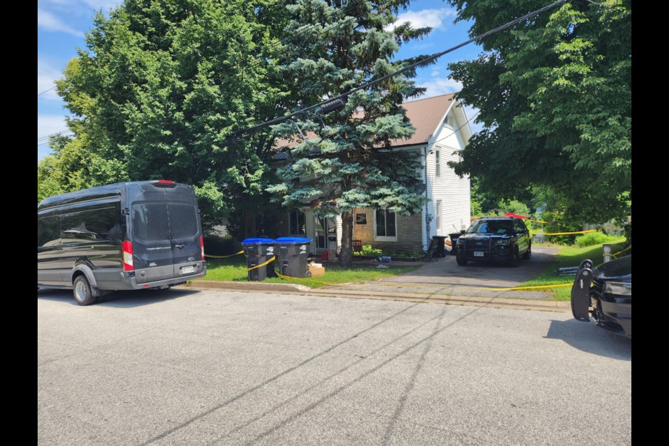 Police continue to maintain a presence Wednesday at the scene of a homicide on Seventh Street.