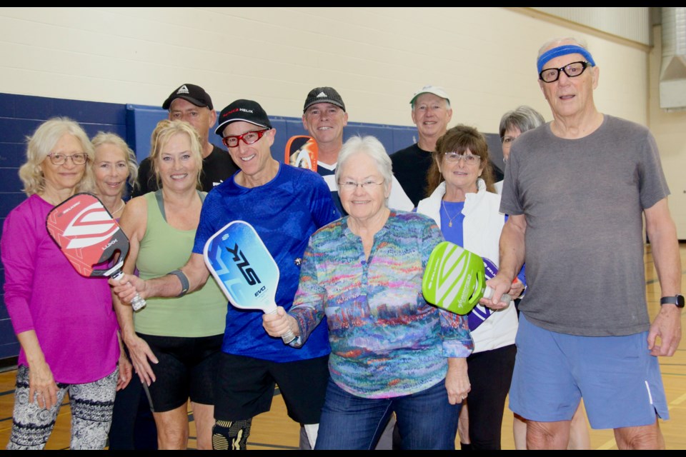 Judy Contin, centre front, is seen with pickleball players at the Askennonia Senior Centre in Midland. 