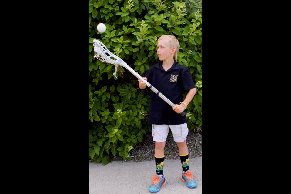 Midland Titans Lacrosse player Wyatt Coughlin, 7, sits at the top of the score board for all ages in the zone with 104 points in the regular season so far.