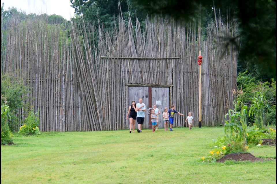 A family is seen leaving the Huron Ouendat Village at Huronia Museum in Midland. 