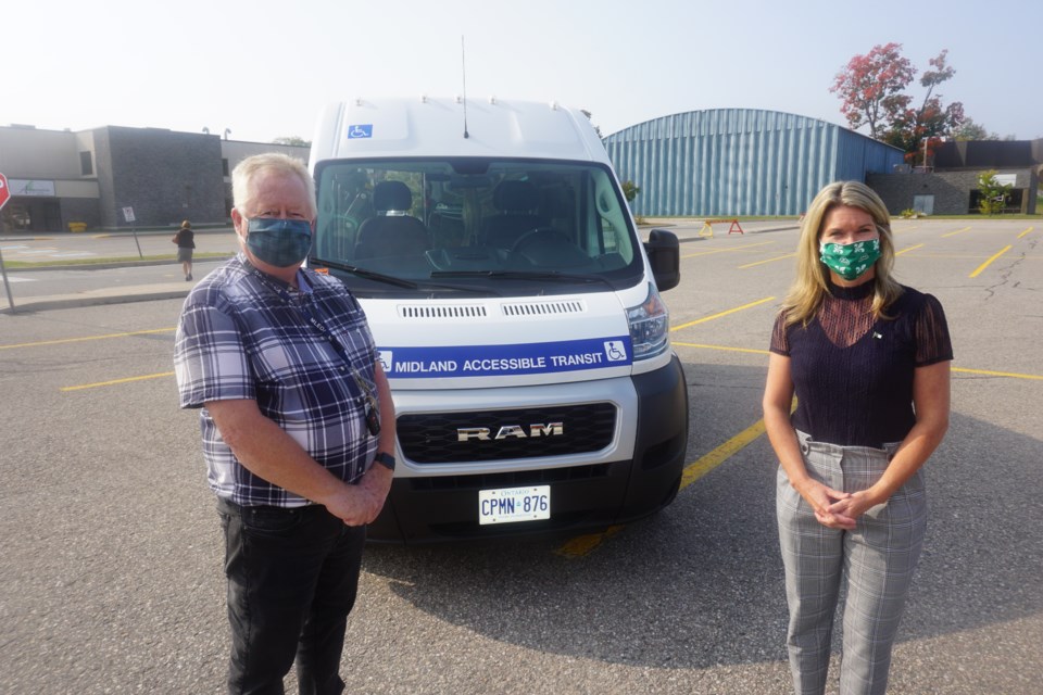 Midland Mayor Stewart Strathearn and Simcoe North MPP Jill Dunlop stand in front of a new transit van. Andrew Philips/MidlandToday                        