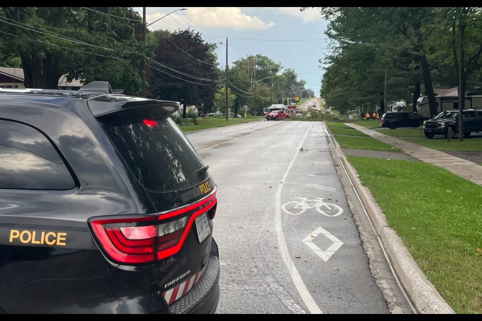 OPP officials closed a portion of Hugel Avenue after a brief but powerful storm uprooted trees in the area.