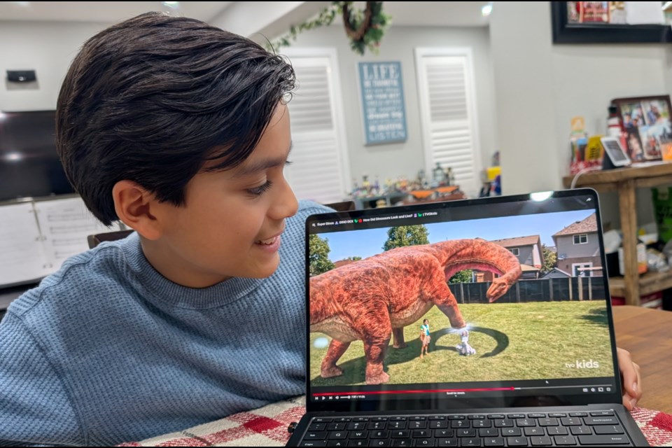 JP Romero checks out a scene from his newly-released Dino Dex TV series.