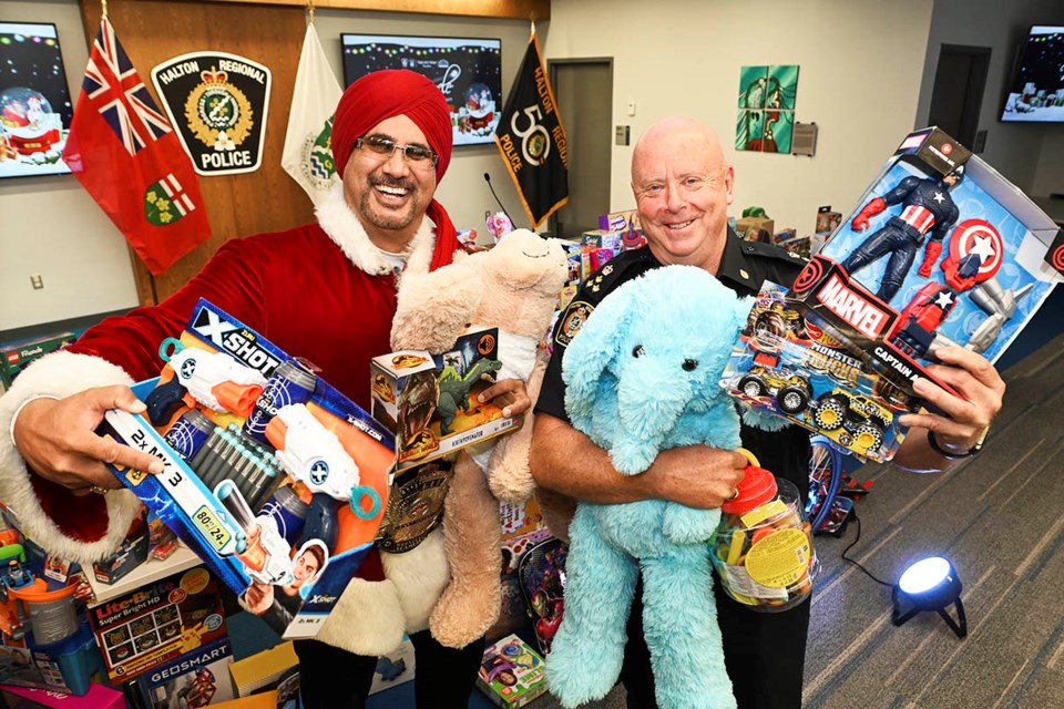 Miracle on Main Street co-founder Tiger Ali Singh Jr. alongside Halton Police Chief Stephen Tanner at the 16th annual Miracle on Main Street kick-off.