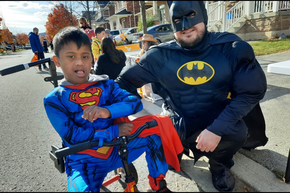 Taksh Chir, rockin' his Superman attire, meets fellow superhero Batman (Jeff Gorman) at the Treat Accessibly trick or treat event on Kincardine Terrace Sunday afternoon. The event, organized by Megan Walker of WeeCare Health, and her neighbours offered an inclusive Halloween experience for kids with mobility issues and other special needs. Neighbours set up curbside treat stations, while a fire truck was on hand for the costumed cuties to tour.