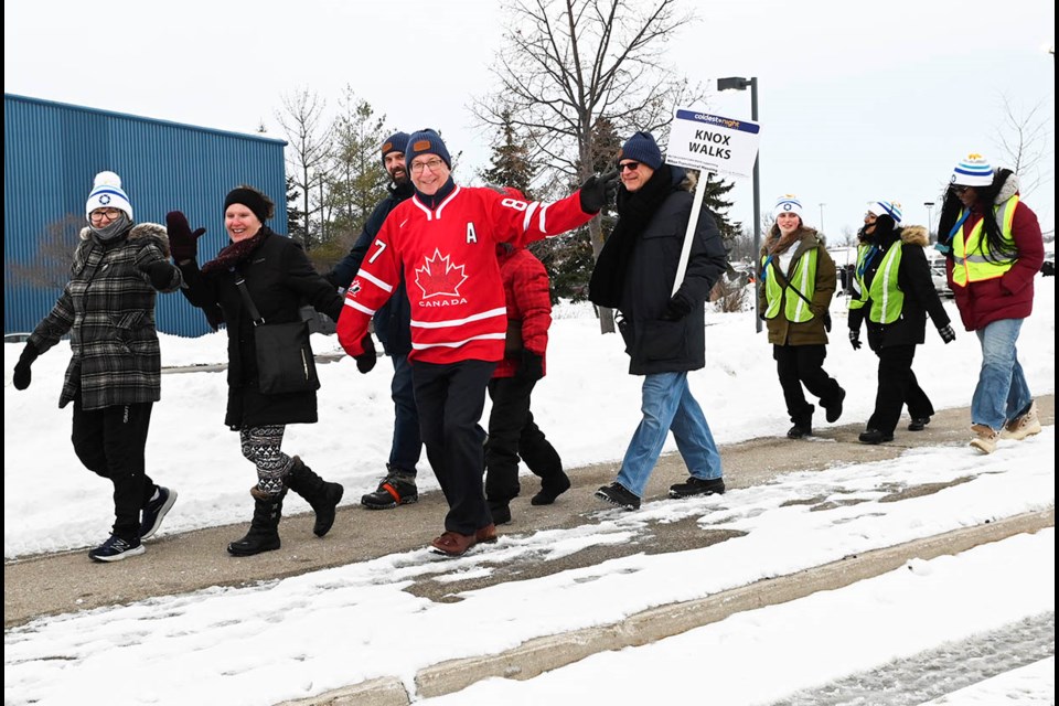 Team Knox Walks makes its way along Santa Maria Blvd. during the Coldest Night of the Year (Downtown Main) walk in support of Milton Transitional Housing. The team raised almost $3,600 in pledges.