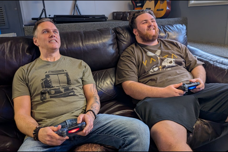 Re:Soul director Michael Burns and  intern Mike Denis chill with a little video games play at the youth centre.