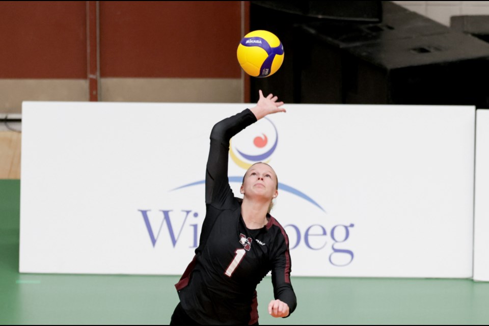 Emma McKinnon delivers a serve in Friday's U Sports quarterfinal play against Montreal.