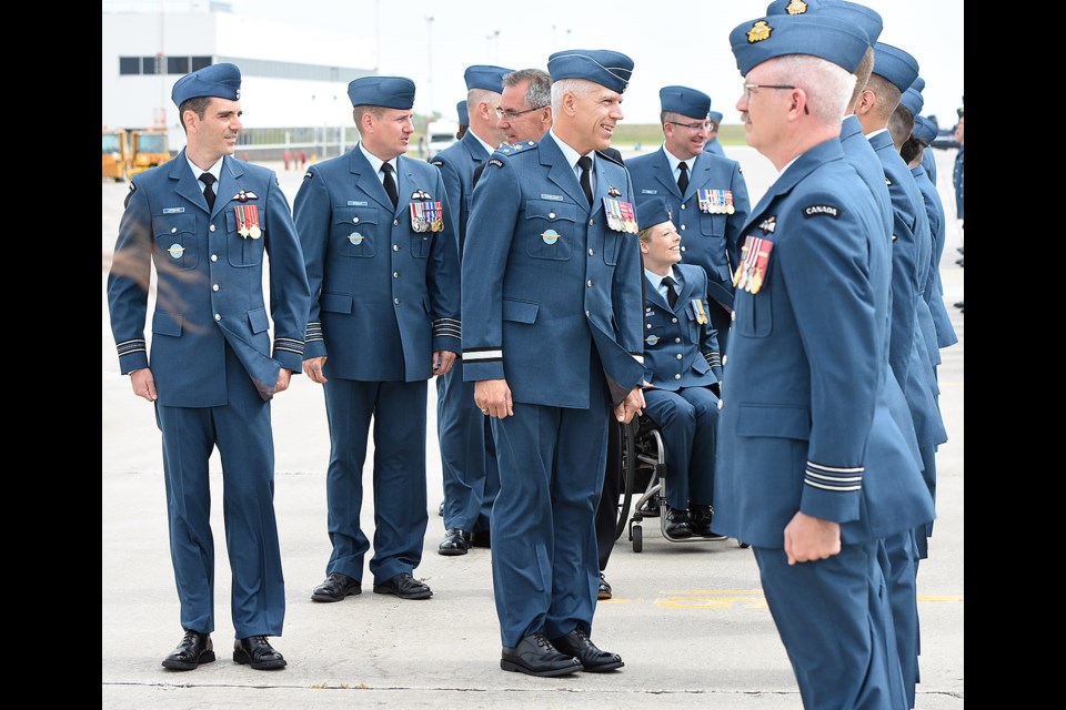 Brigadier General Mario Leblanc is joined by fellow dignitaries in a review of 15 Wing troops.