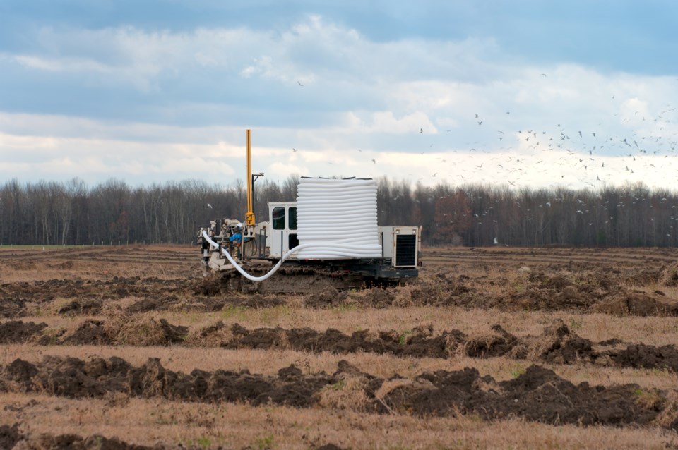 heavy-machinery-installs-farm-drainage-tile-simplycreativephotography-istock-getty-images-plus