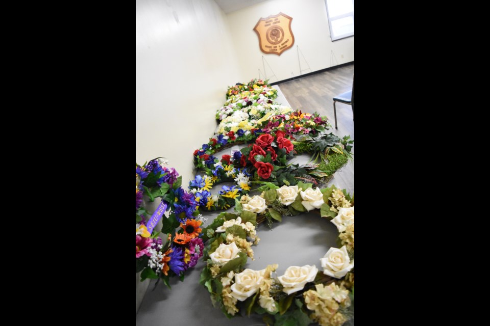 Wreaths from various worker’s unions and organizations on display before being laid.