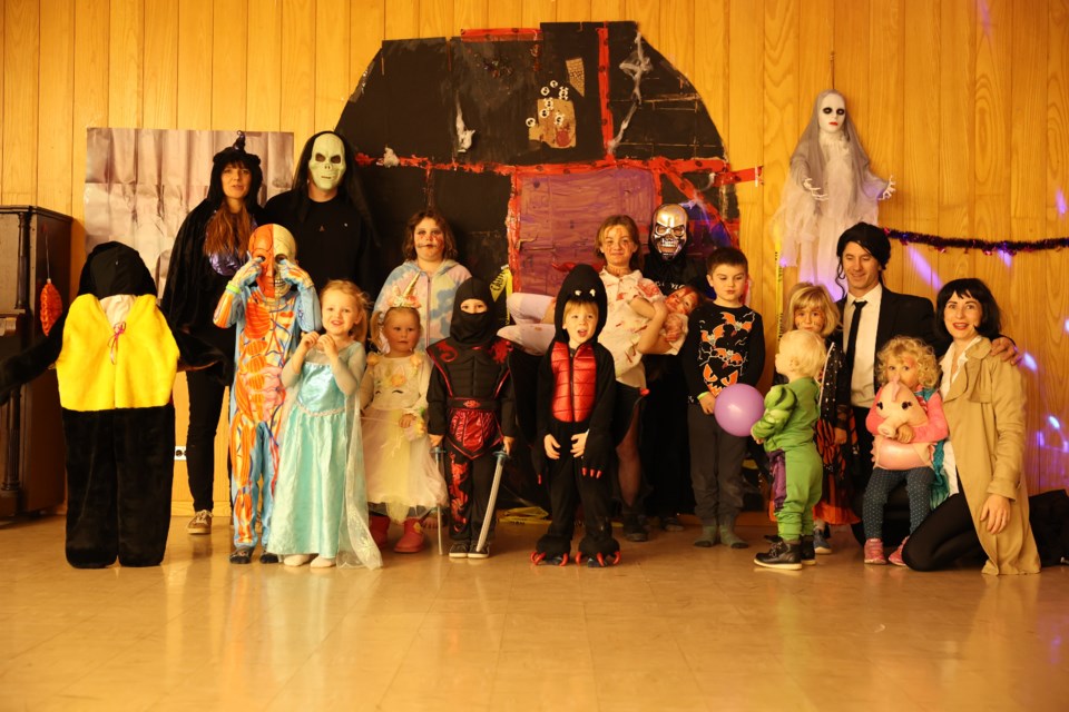 Children and volunteers enjoy the Halloween Hustle party hosted by Roots school and held at St. Andrew’s Church.