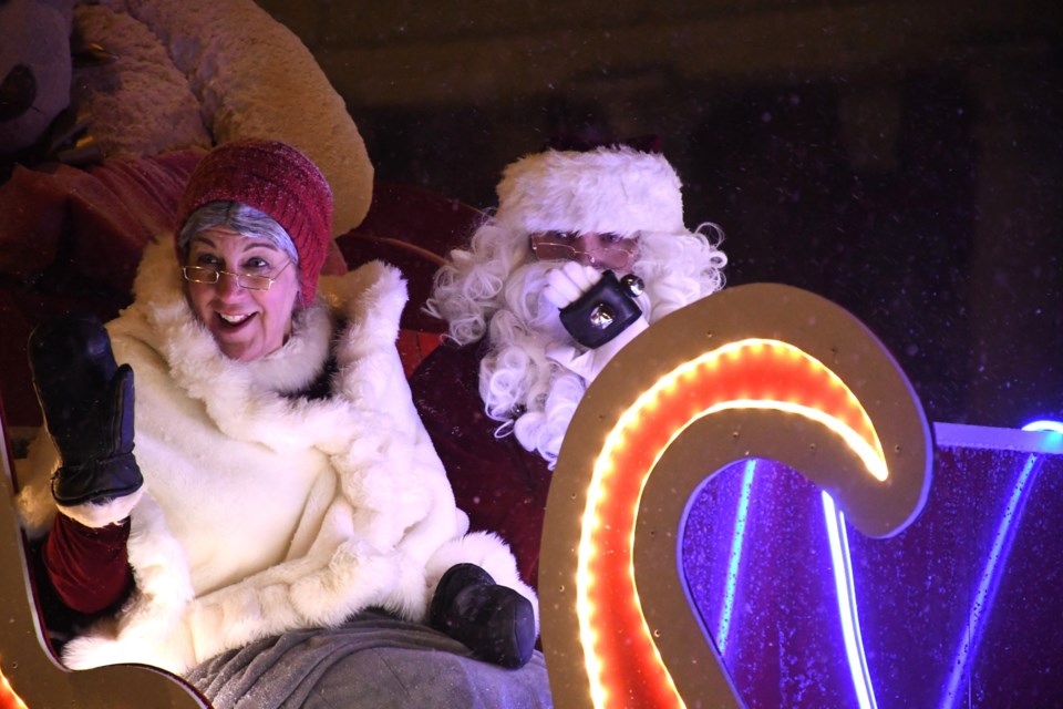 Mrs. Claus (left) and Santa Claus (right) followed the 2024 Kinsmen Santa Claus Parade before meeting with young guests for family portraits, cookies, and hot chocolate at the Moose Jaw Events Centre on Dec. 8.