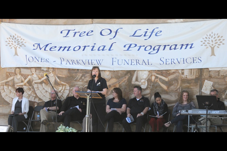 Jones-Parkview Funeral Services grief support worker and funeral celebrant Della Ferguson welcomes patrons to the Tree of Memory ceremony.