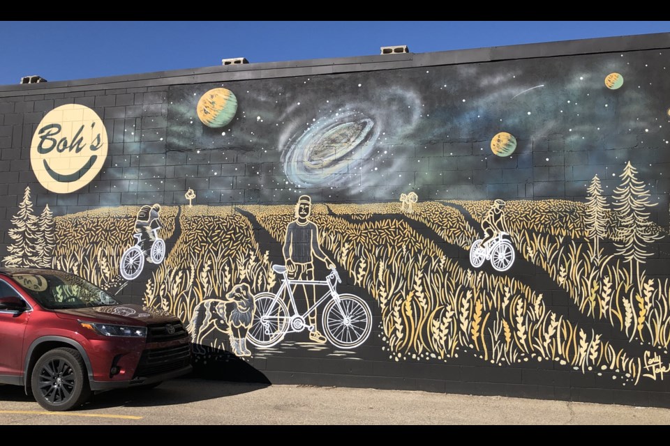 The new mural on the side of Boh's Cycle and Sporting Goods. Photo by Jason G. Antonio